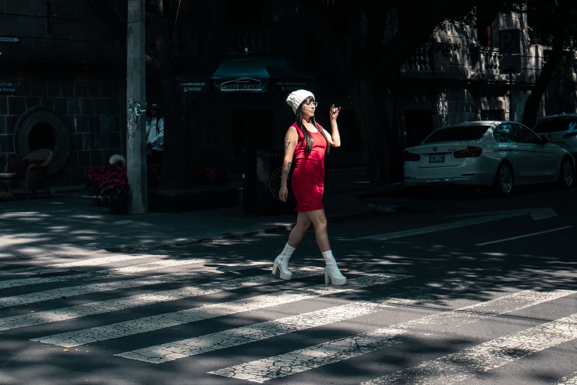 Stylish woman walking in low heels on a city street