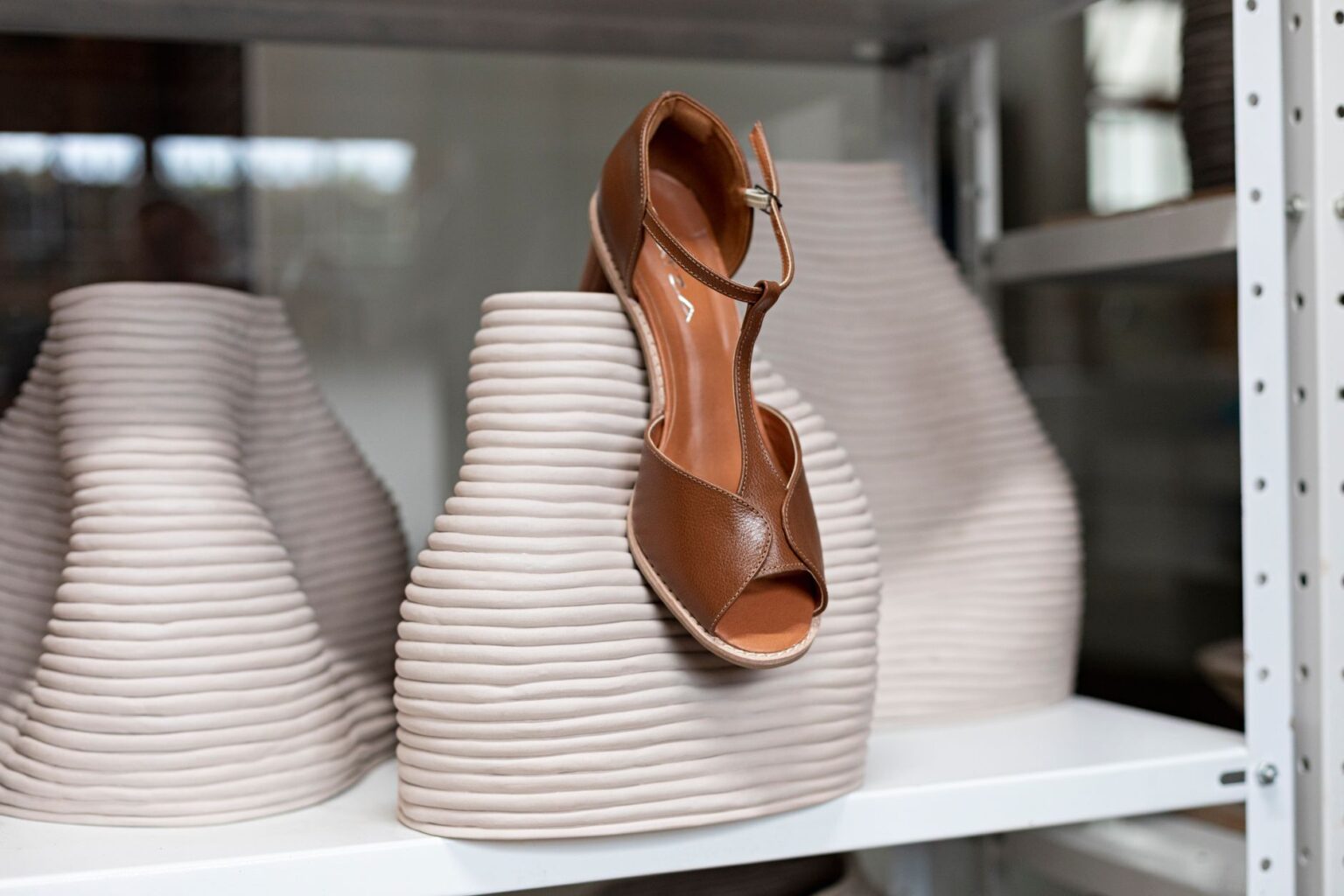 Loro Piana’s Open-Toe Sandal Is Quietly Edging Out the Loafer Close-up of minimalist luxury leather sandals on a clean surface