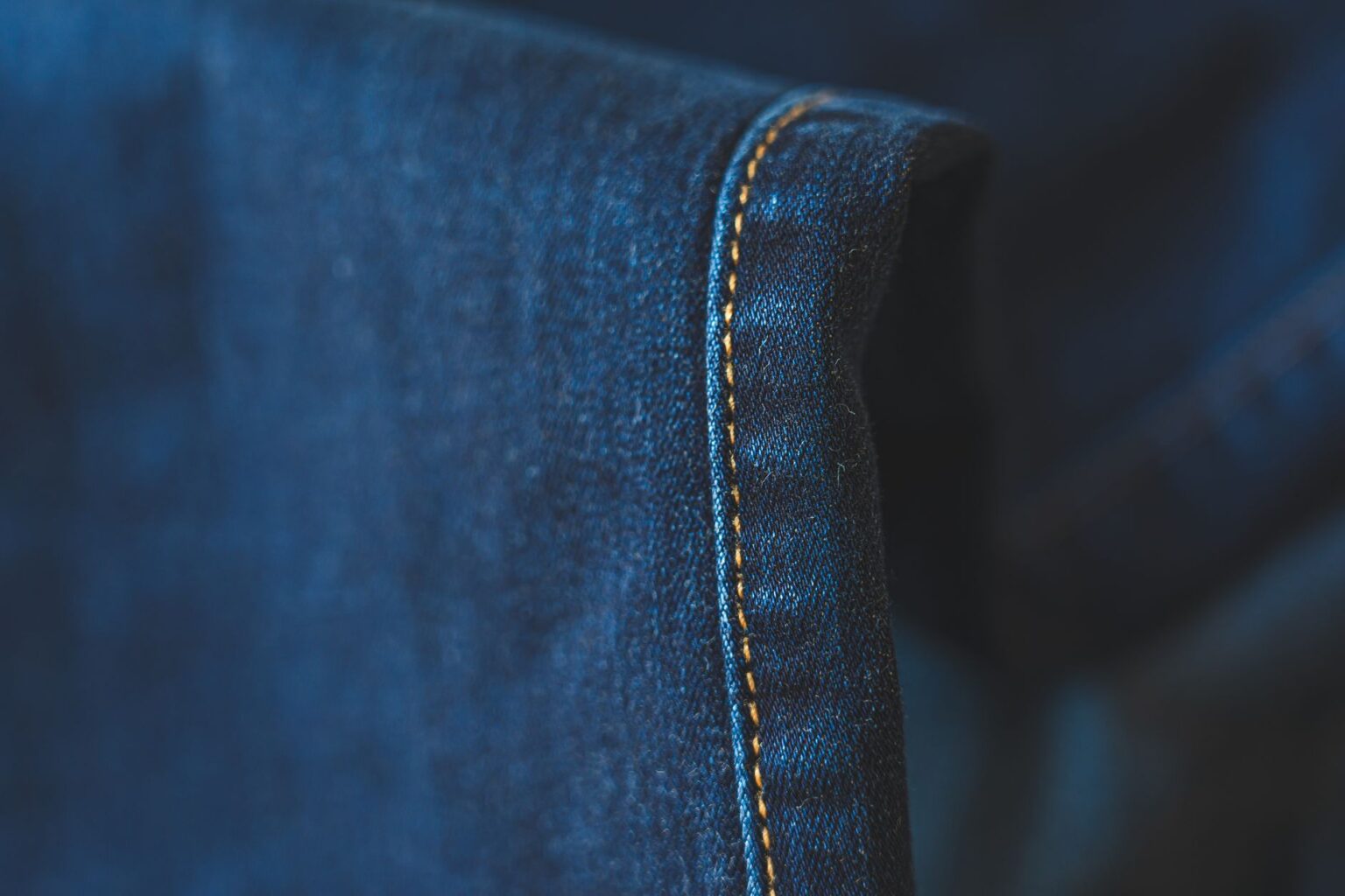 The Quiet Return of Helmut Lang’s Raw Hem Denim Close-up of raw hem denim jeans showing unfinished frayed edge at ankle