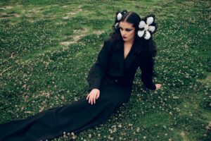 A dark, moody fashion editorial image representing avant-garde clothing aesthetics