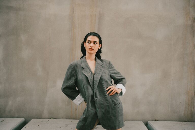 Saint Laurent’s Tuxedo Blazer Is Quietly Outlasting the Leather Jacket A woman wearing a sharp black tuxedo blazer with satin lapels