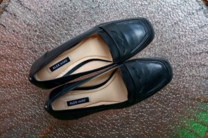 Classic Mary Jane shoes displayed on a clean surface, showing rounded toe and single strap detail