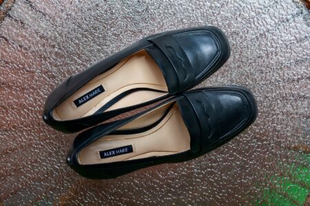 Classic Mary Jane shoes displayed on a clean surface, showing rounded toe and single strap detail