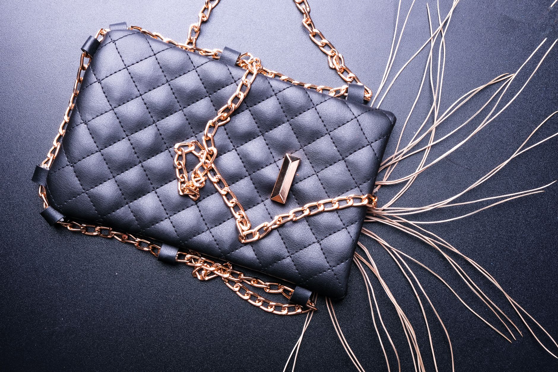 A structured leather woven clutch bag displayed on a neutral background