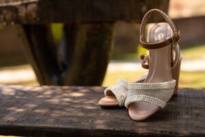 Chloé’s Woody Sandal Is Quietly Edging Out the Espadrille Close-up of wooden block-heel sandals on a neutral background