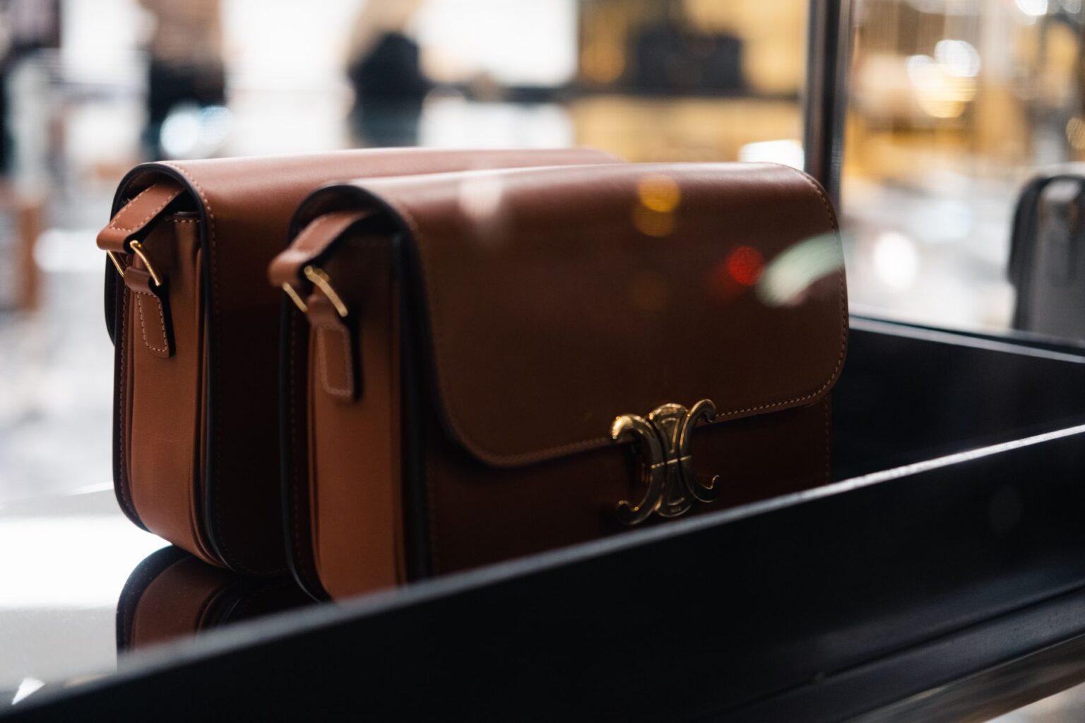 Bottega Veneta’s Andiamo Bag Is Quietly Unseating the Tote A structured leather top-handle bag photographed on a neutral background