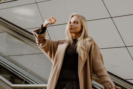 Jil Sander’s Minimal Coat Is Quietly Outlasting the Puffer Moment A structured minimal wool overcoat displayed against a neutral background