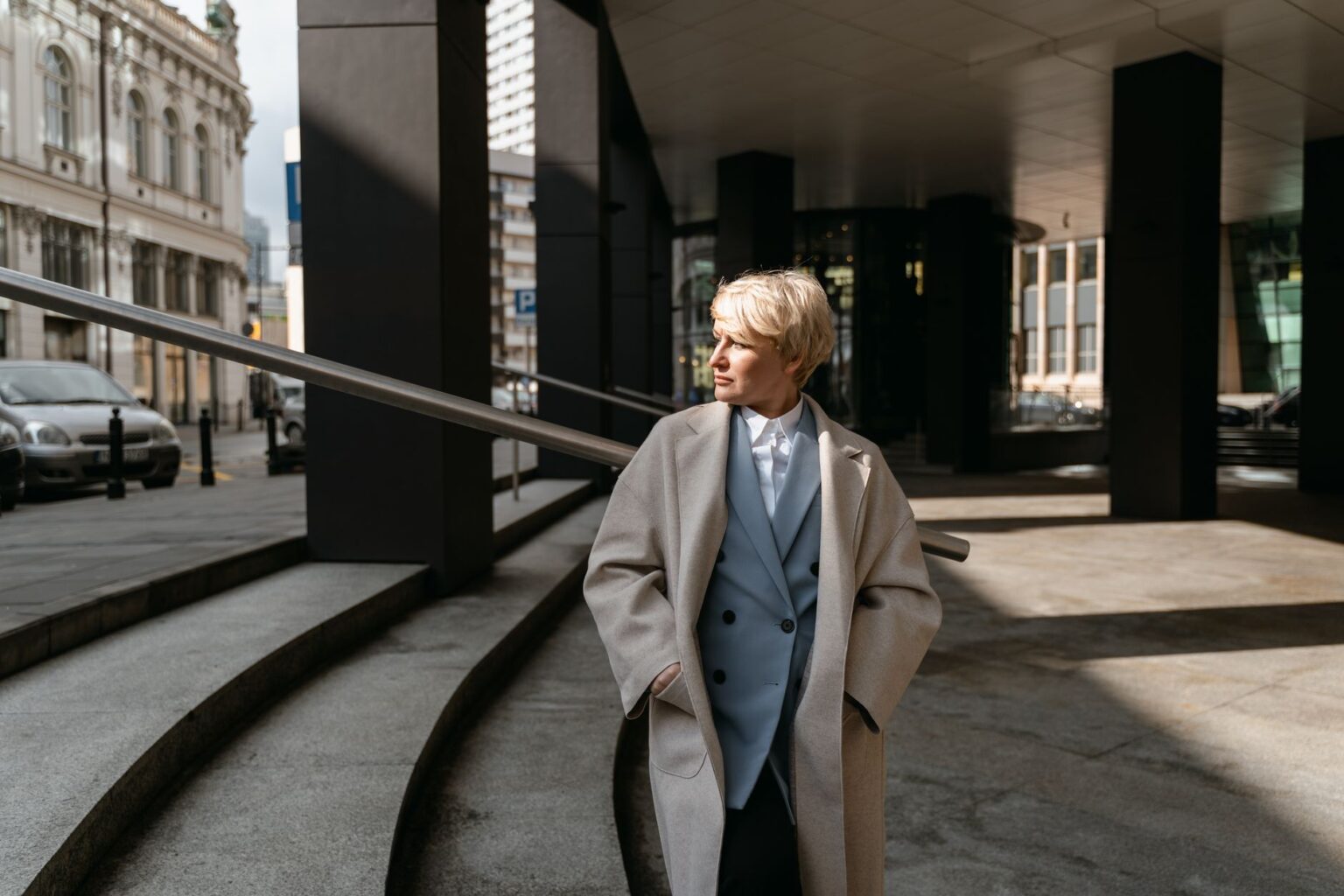 Bottega Veneta’s Drop Shoulder Jacket Is Edging Out the Trench Model wearing a structured oversized drop shoulder coat in neutral tones
