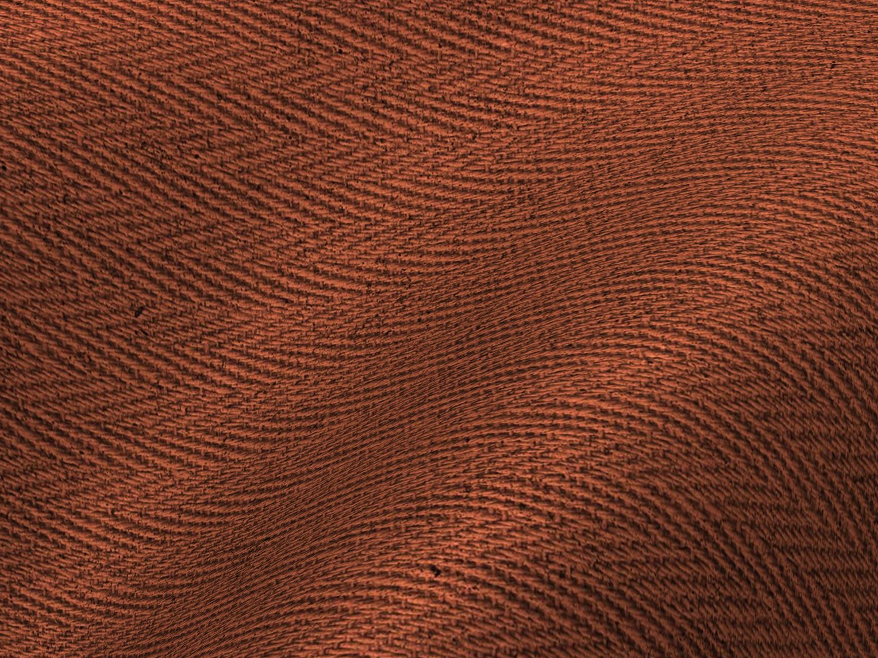 Close-up of intrecciato woven leather texture in deep tonal color