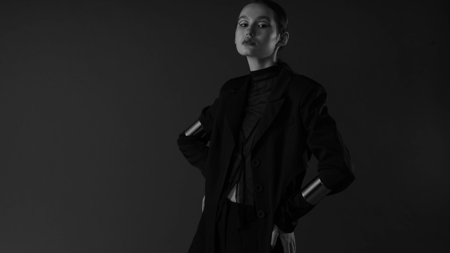 Minimalist fashion editorial styling with straight-leg trousers and simple footwear