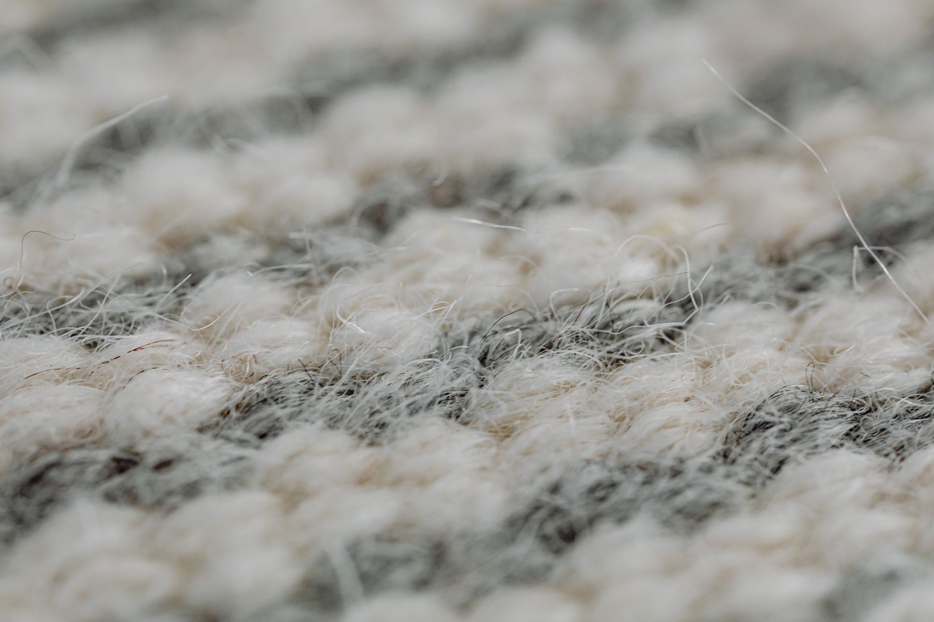 Close-up of fine wool textile showing smooth texture and natural fiber weave