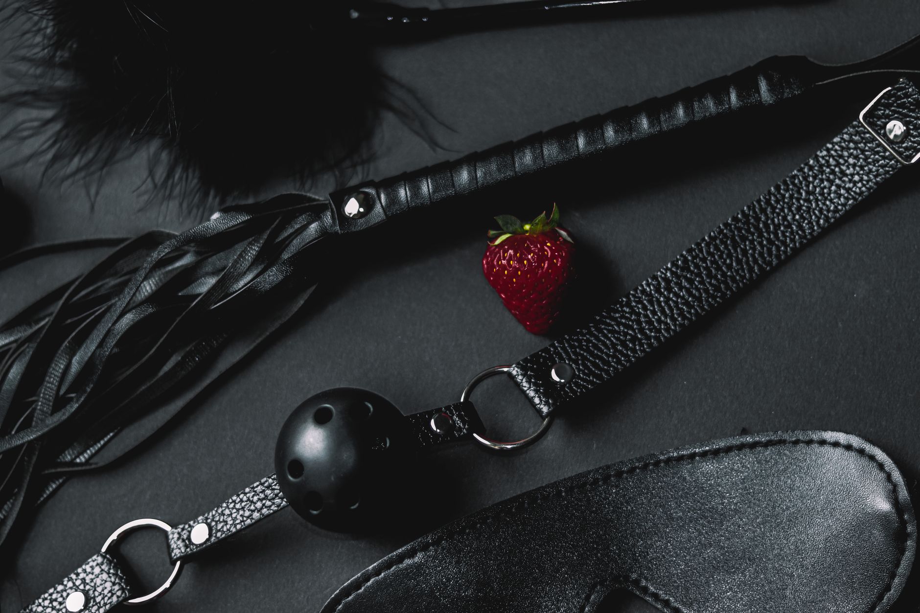 Red leather fashion accessories including bag and shoes demonstrating luxury craftsmanship