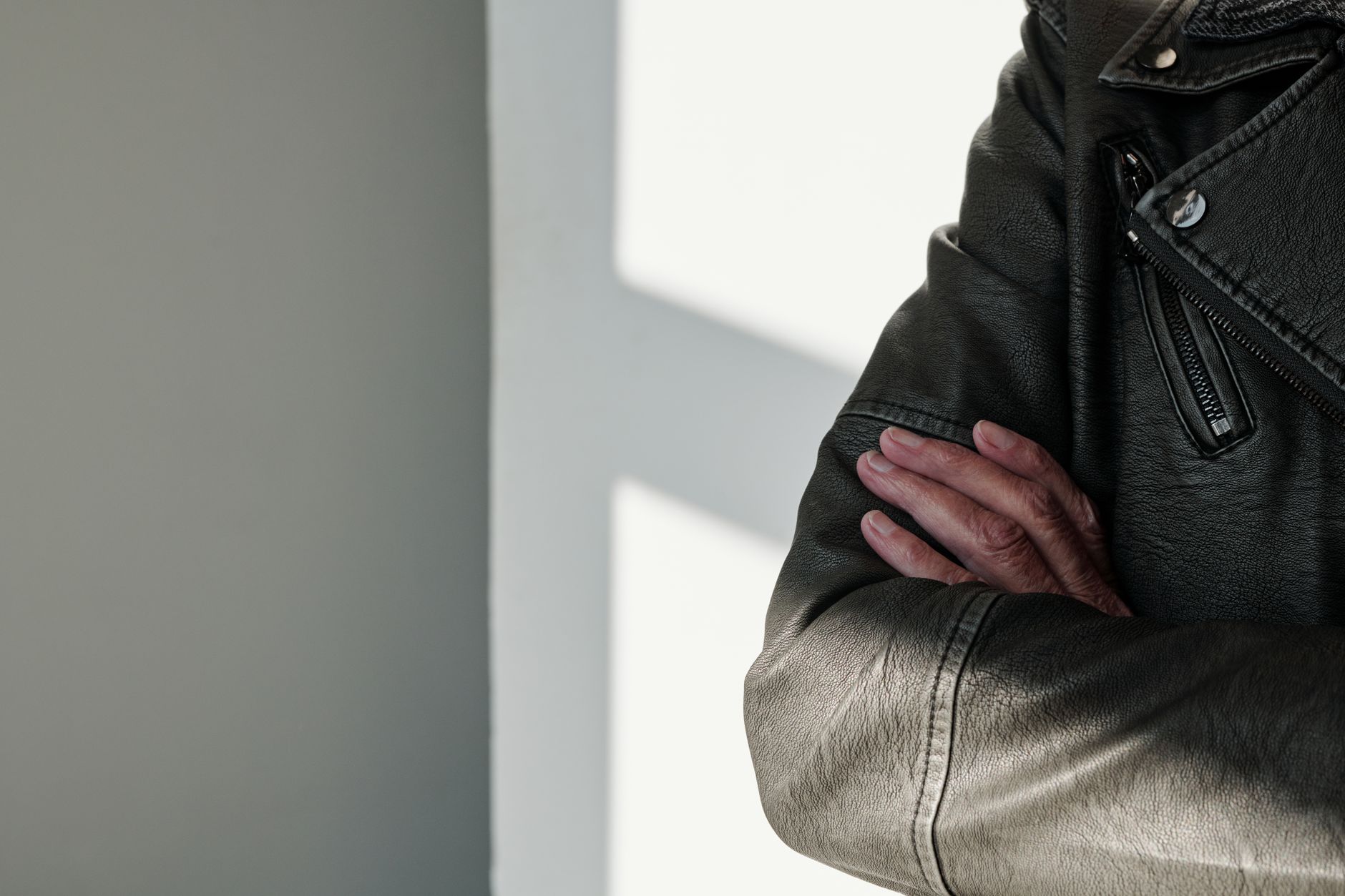Luxury designer outerwear pieces arranged in a minimal retail setting