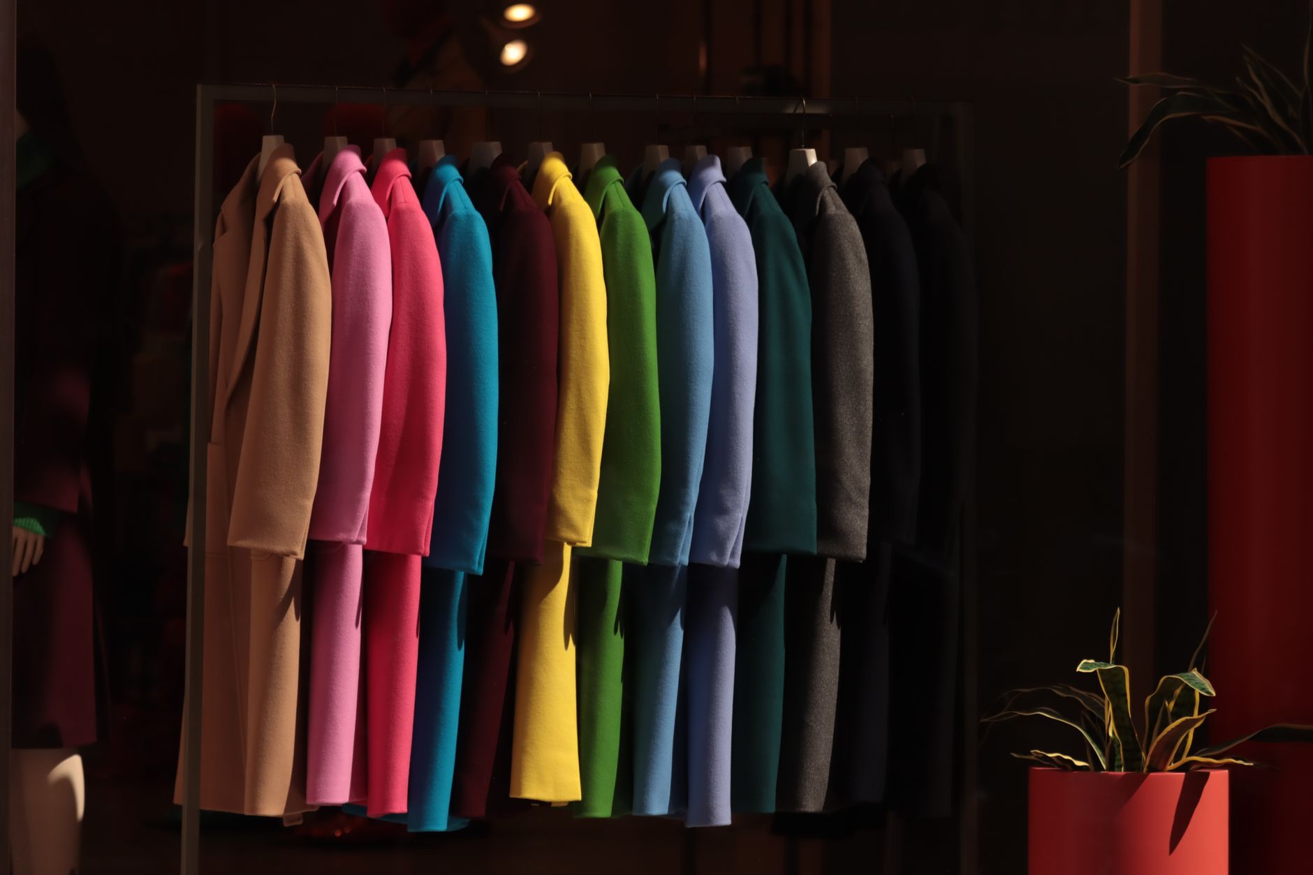 Neatly styled outerwear arranged in a minimal wardrobe setting