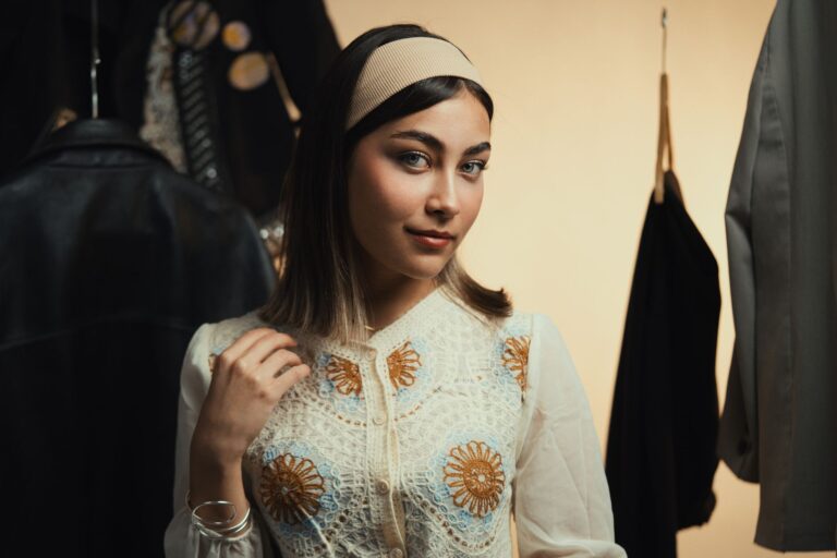 The Padded Headband Is Quietly Edging Out the Hair Clip A woman wearing a wide padded velvet headband as a fashion accessory