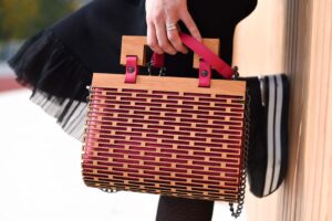 Bottega Veneta’s Jodie Bag Is Quietly Unseating the Hobo A close-up of a woven leather luxury handbag with knotted handle detail