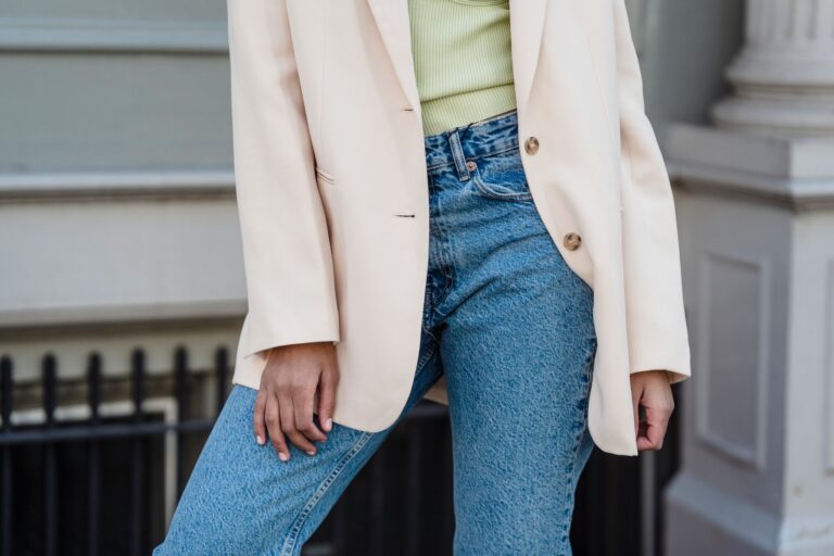 The Unstructured Blazer Is Quietly Edging Out the Tailored Suit A person wearing a relaxed unstructured blazer in a neutral tone over a simple outfit