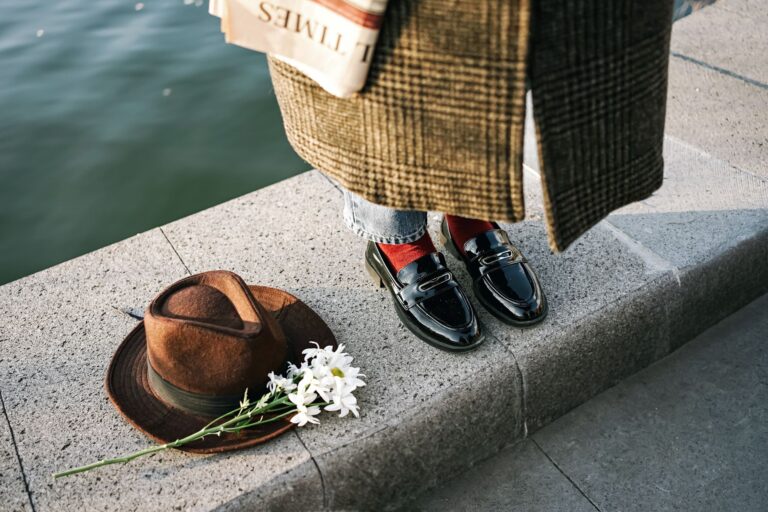 The Padded Loafer Is Quietly Edging Out the Ankle Boot Pair of padded loafers styled with wide-leg trousers on a polished surface