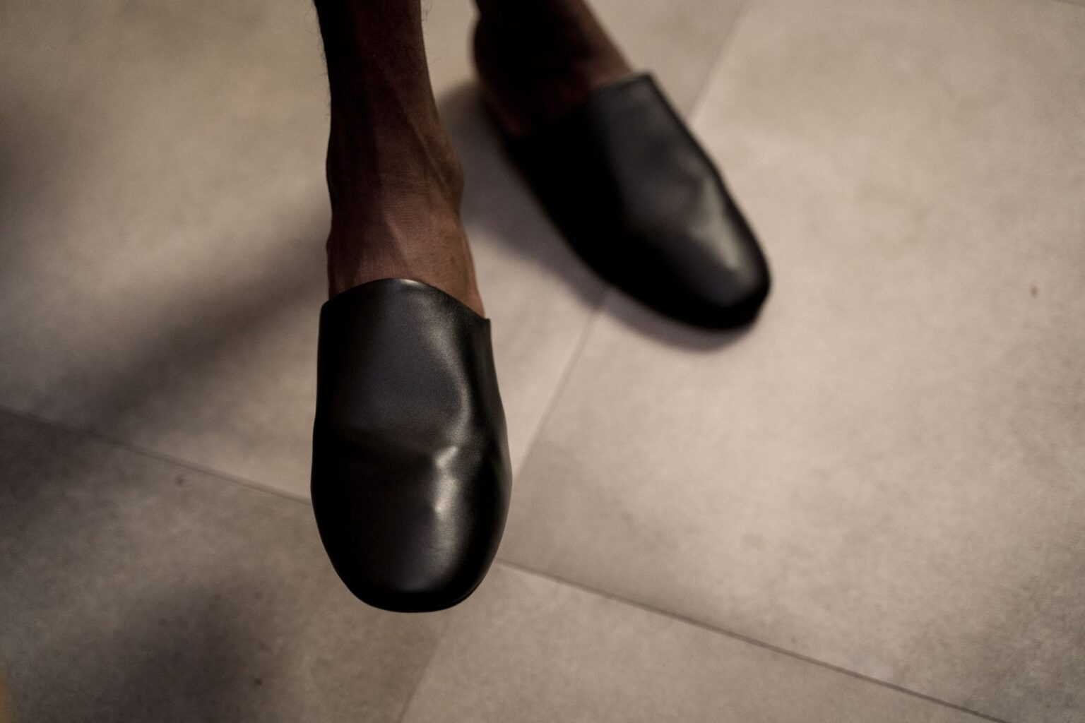 Valentino’s Kitten Mule Is Quietly Edging Out the Strappy Sandal Elegant kitten heel mules displayed on a clean surface, showcasing structured toe box and slender heel design