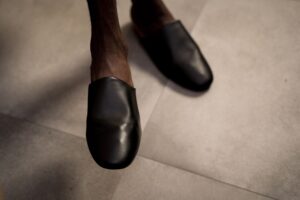 Valentino’s Kitten Mule Is Quietly Edging Out the Strappy Sandal Elegant kitten heel mules displayed on a clean surface, showcasing structured toe box and slender heel design