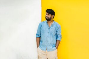 The Linen Shirt Is Quietly Edging Out the Cotton Button-Down Man wearing a relaxed natural linen shirt in neutral tones