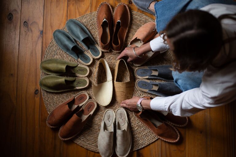 The Grosgrain Ribbon Flat Is Quietly Edging Out the Mary Jane Neutral-toned flat shoes with ribbon detail arranged on a clean surface