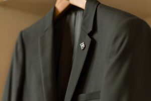 The Exposed Seam Blazer Is Quietly Edging Out the Polished Jacket Close-up of exposed seam construction on a tailored blazer jacket