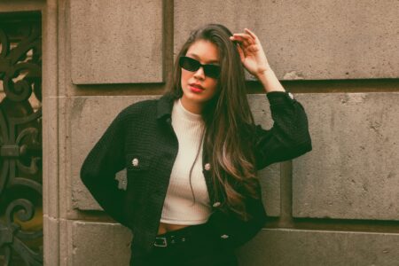 The Tweed Jacket Is Quietly Edging Out the Leather Blazer Woman wearing a tailored tweed jacket styled with modern casual clothing