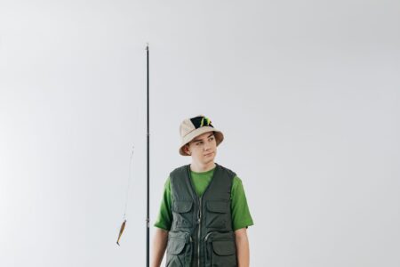 The Fisherman Cap Is Quietly Edging Out the Baseball Hat Person wearing a neutral-toned fisherman cap on a city street