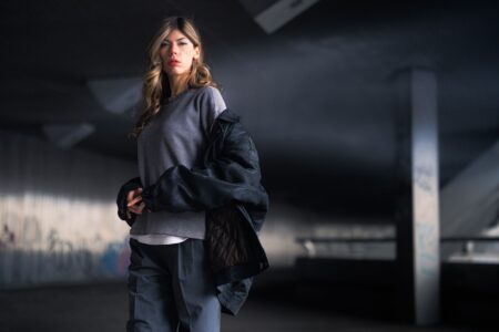 The Oversized Shirt Jacket Is Quietly Edging Out the Trench Coat Person wearing an oversized shirt jacket as an outer layer on a city street