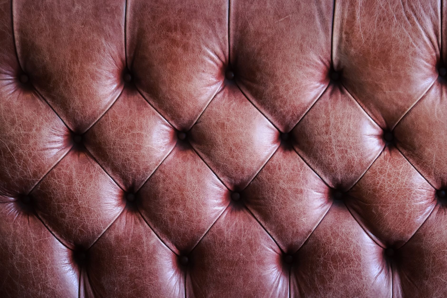 Close-up of intricately woven leather texture showing detailed craftsmanship and material quality