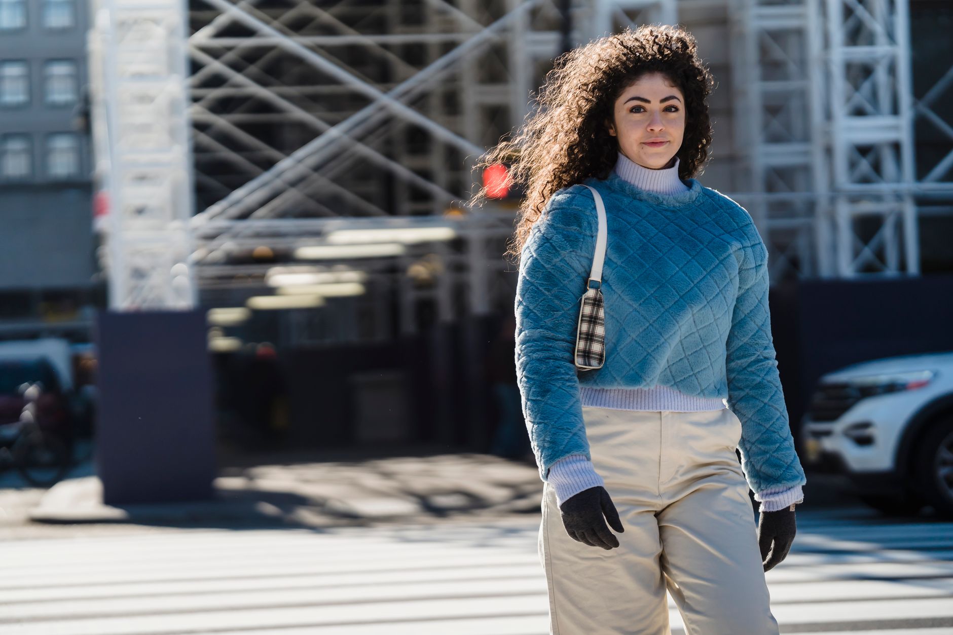 Street style look featuring relaxed-fit trousers and an oversized jacket
