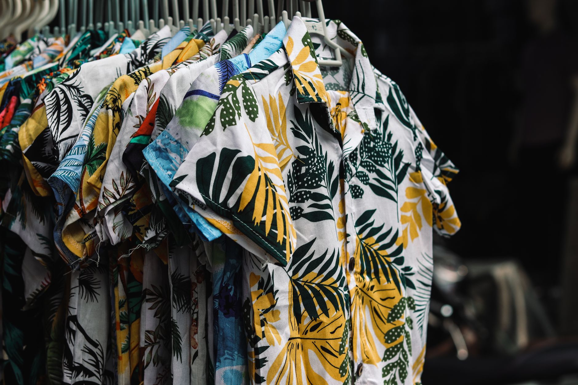 Relaxed linen garments hanging on a boutique clothing rack
