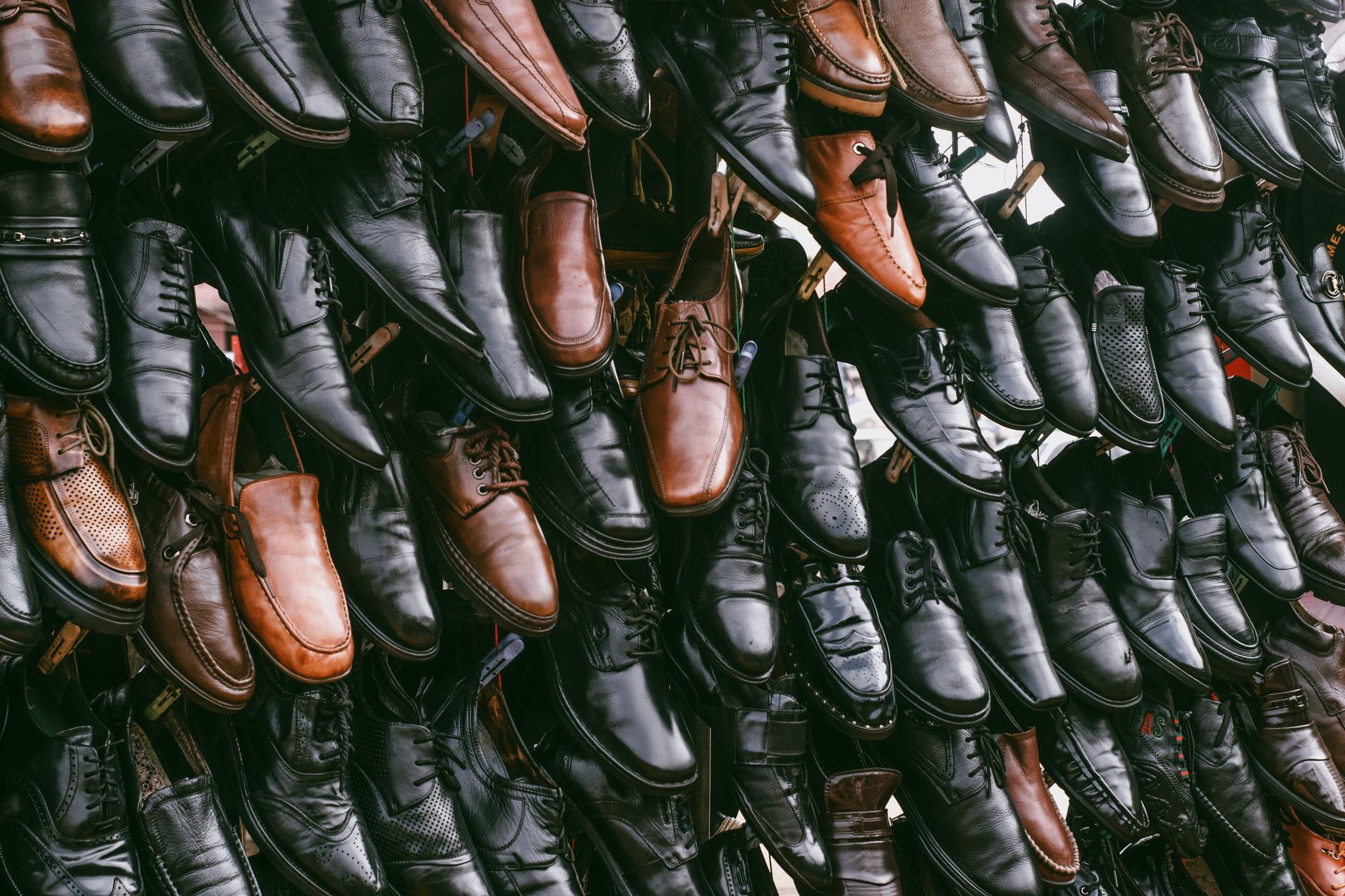 Elegant flat shoes arranged on a minimalist display shelf