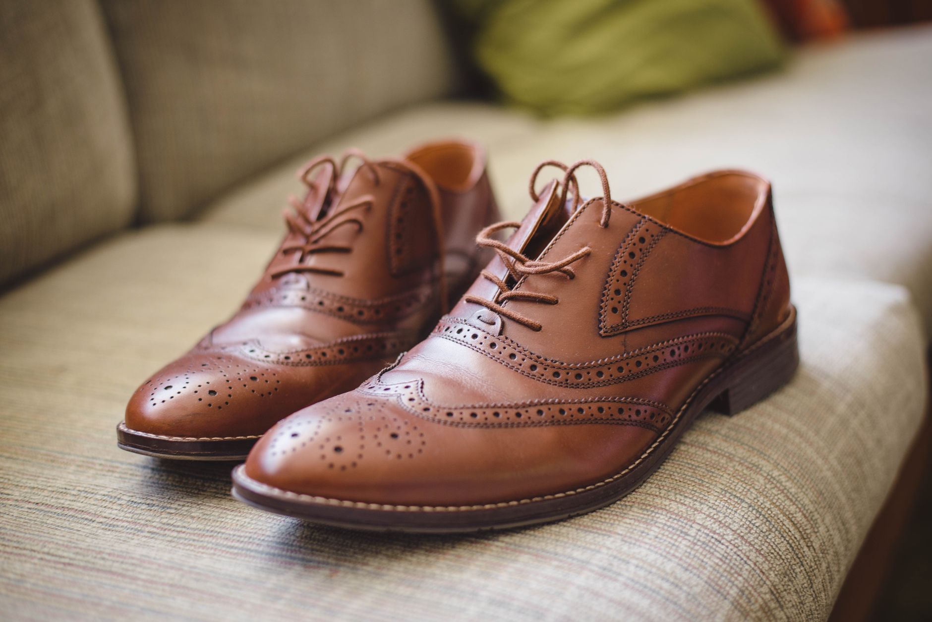 Close-up detail of fine leather shoe construction showing stitching and sole