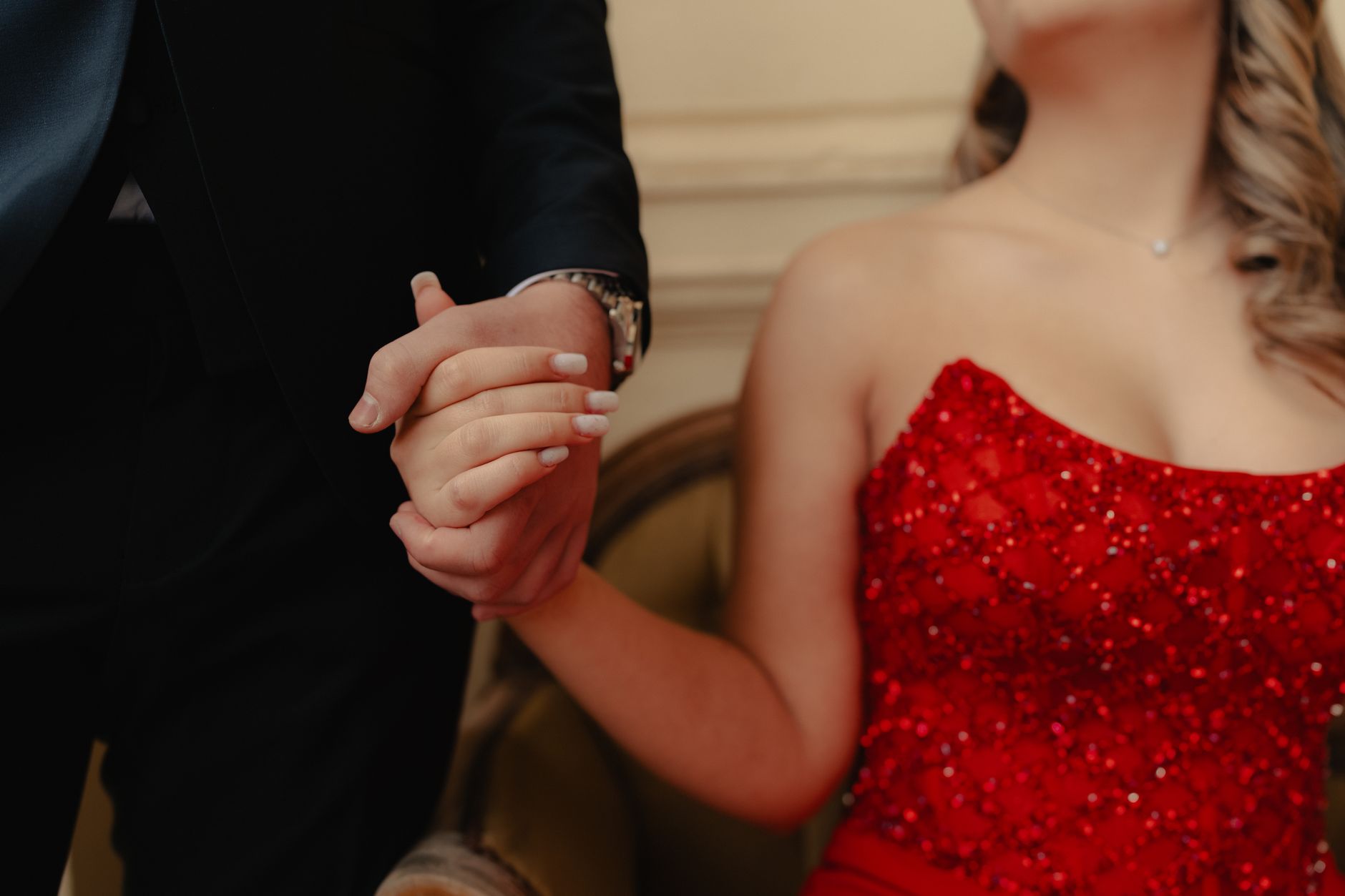 Woman in a minimal column gown styled with short leather gloves at a formal event