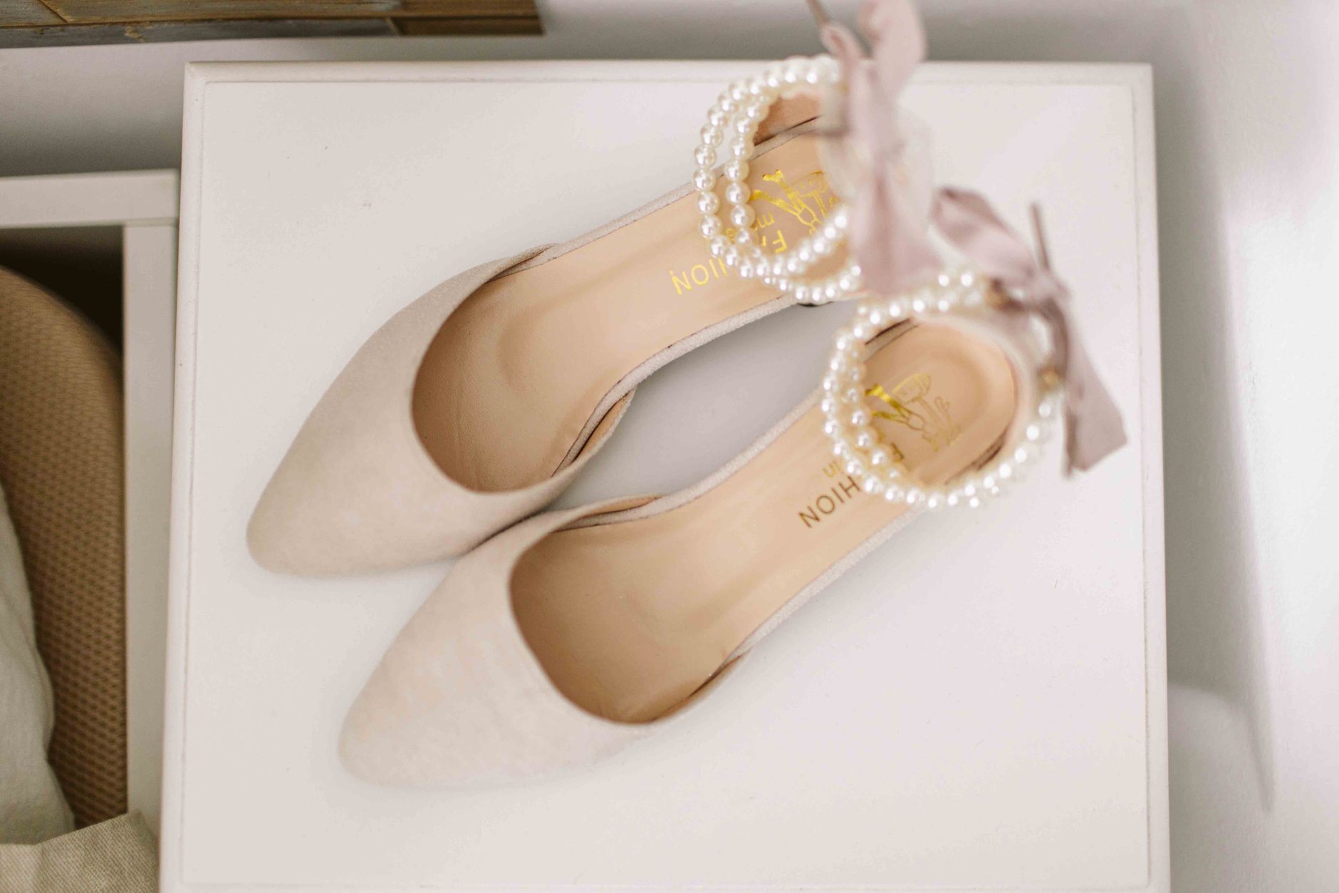 Row of elegant low-heeled sandals displayed in a boutique setting