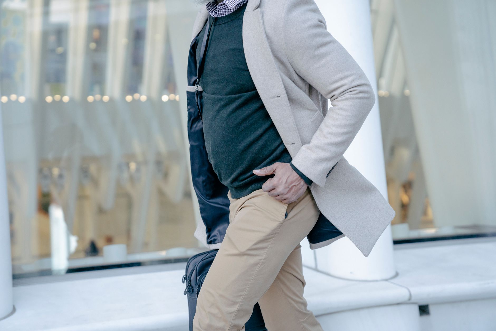 Relaxed layered outfit featuring an oversized shirt jacket over trousers and a white tee