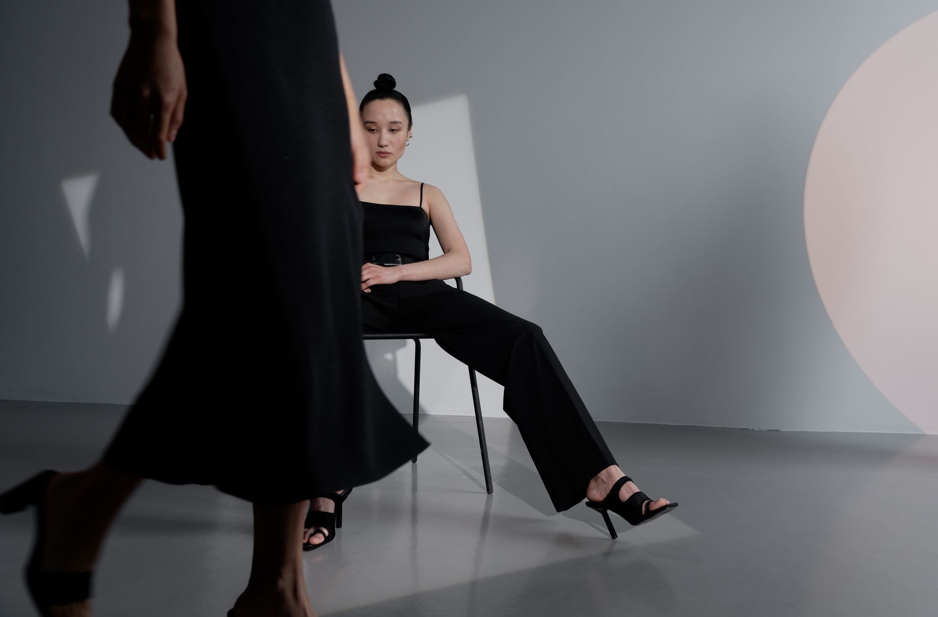 A woman in a minimalist outfit styled with a padded headband