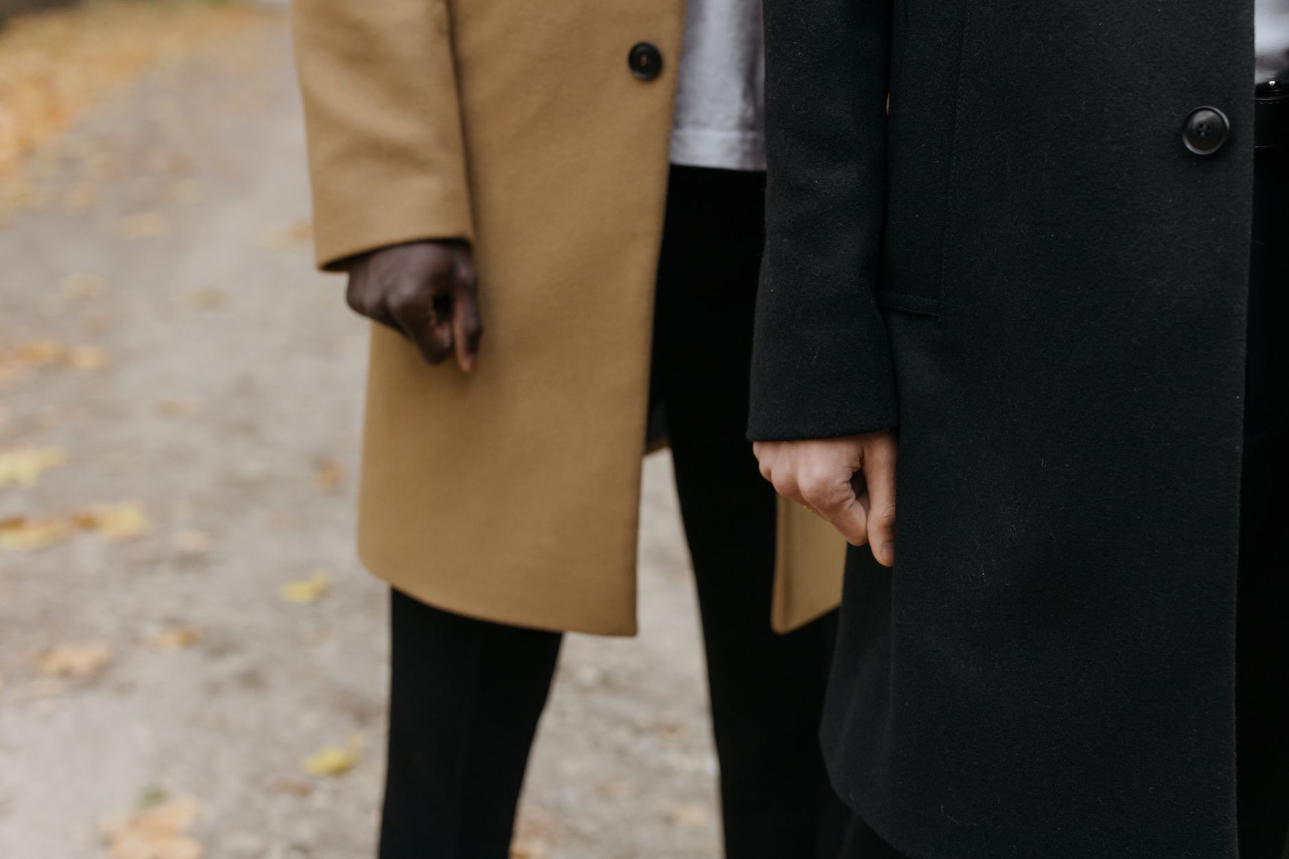 Close-up detail of a structured coat collar and button closure