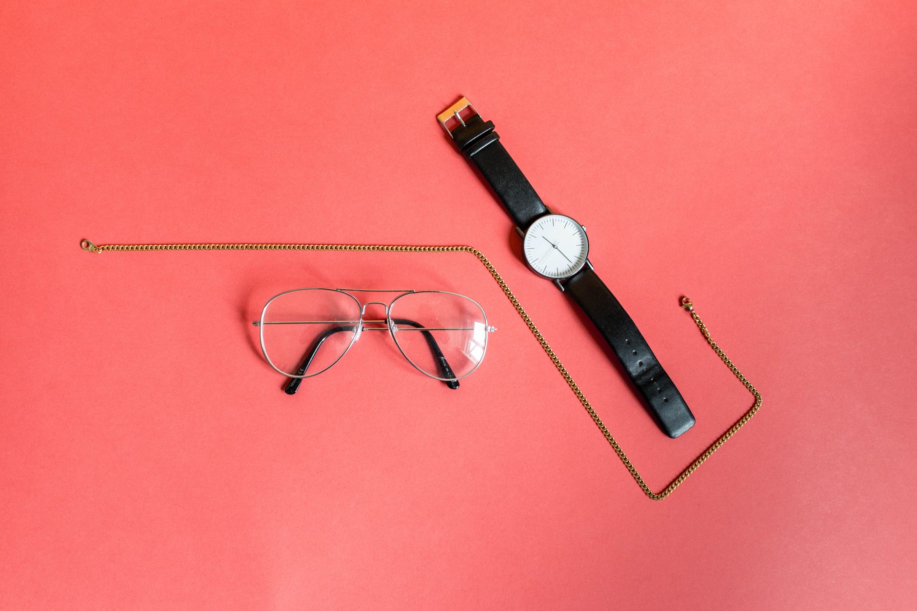 Flat lay of minimal fashion accessories including a foldable bag, representing quiet luxury style
