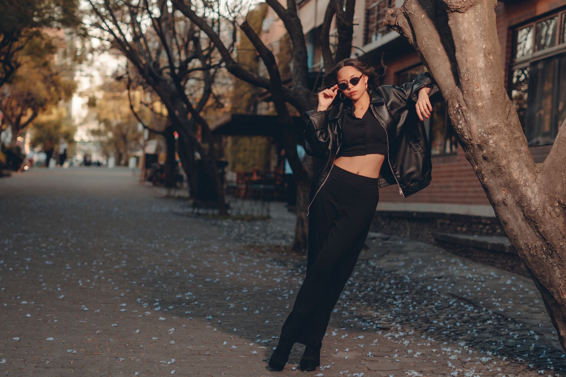 Street style look featuring a slim scarf worn as the primary neck accessory