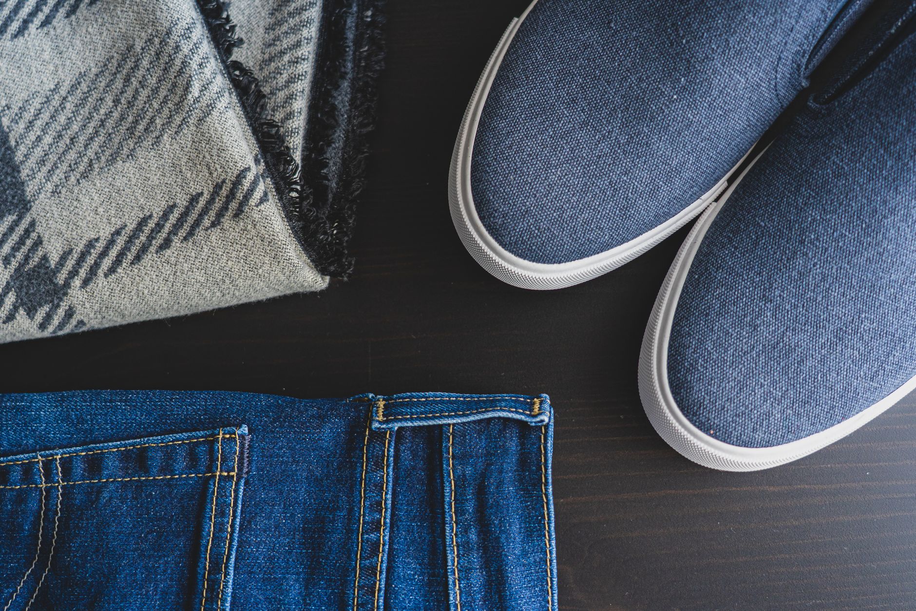 Flat lay of women's shoes including heels and flats arranged on a neutral background