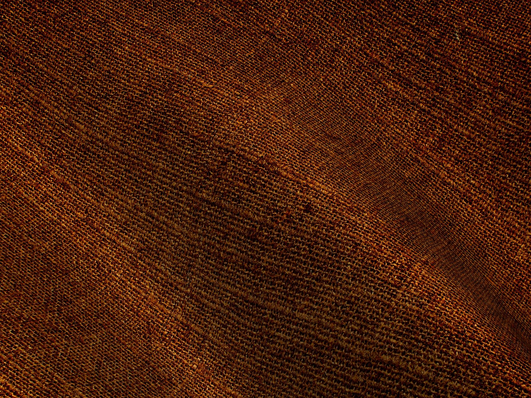 Close-up of lightweight natural fabric texture showing weave detail in neutral tones