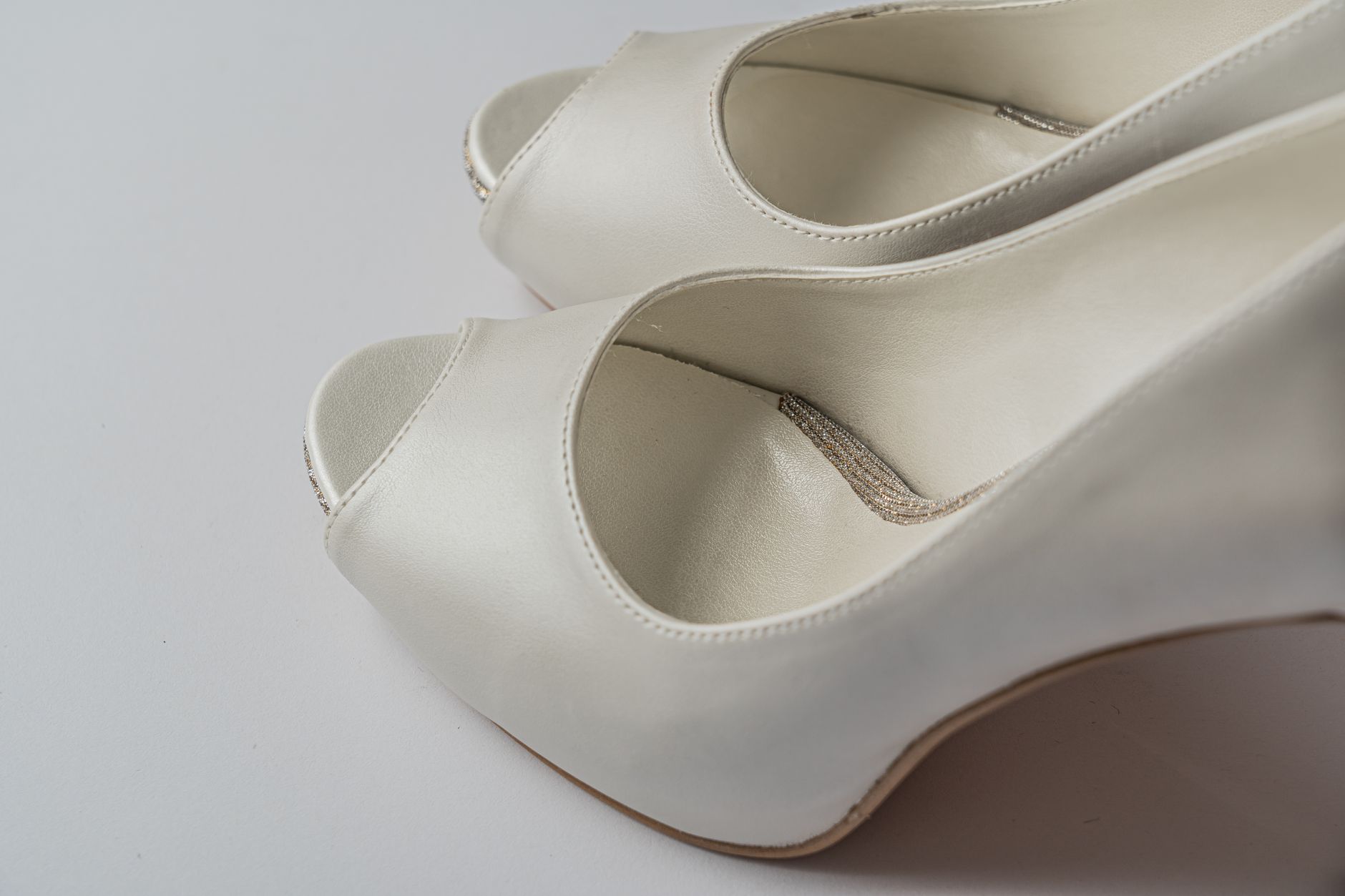 Close-up of women's flat shoes with decorative ribbon bow detail