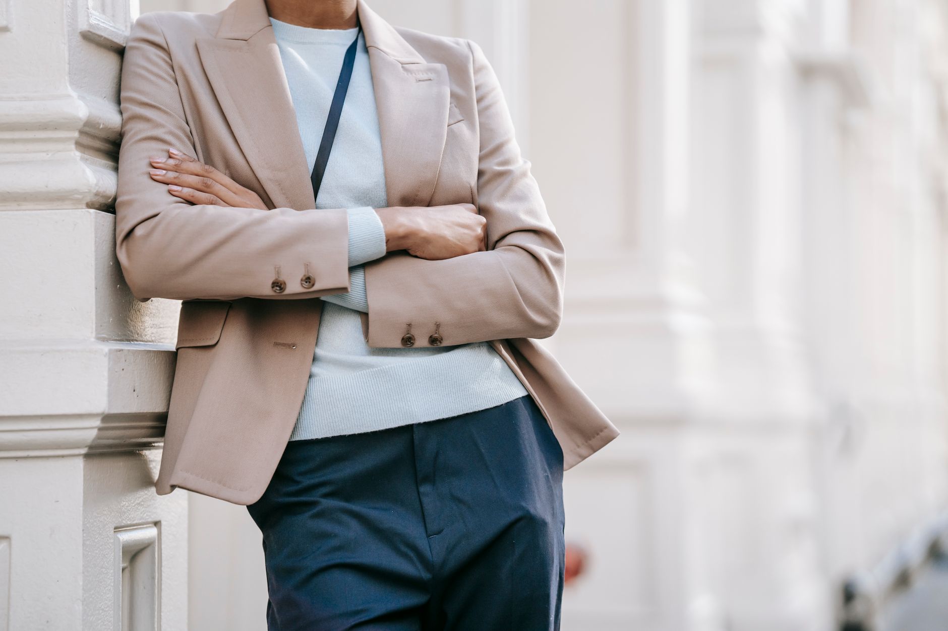 Person styled in an oversized blazer with exposed stitching details