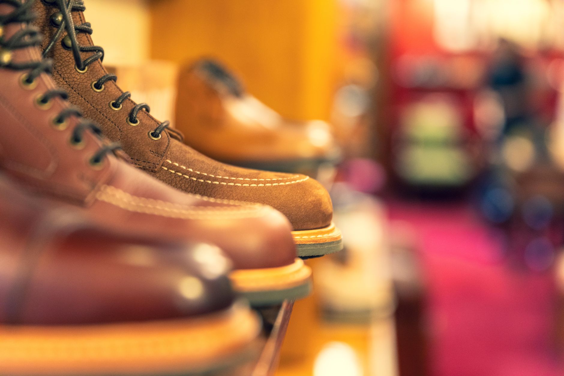 Interior of an upscale shoe boutique displaying designer footwear