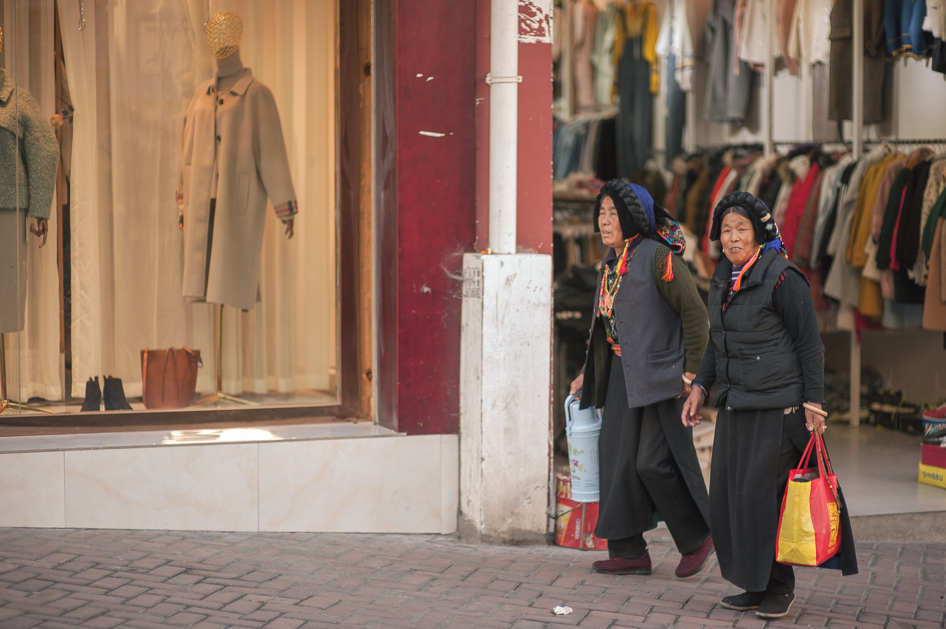 Stylish woman walking on a city street in refined casual clothing