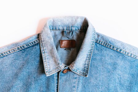 Close-up of contrast stitching along the seam of a structured blazer