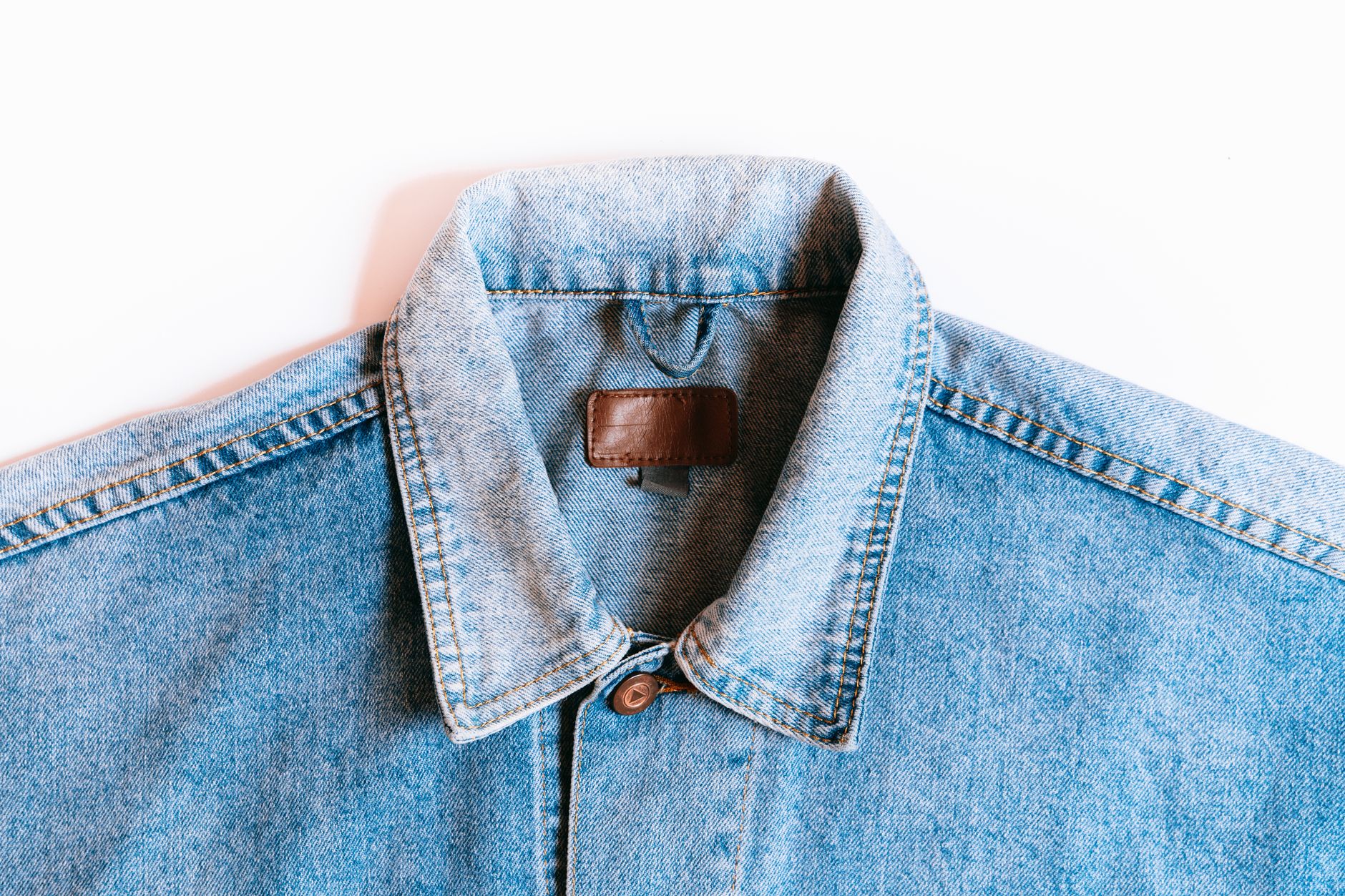 Close-up of contrast stitching along the seam of a structured blazer